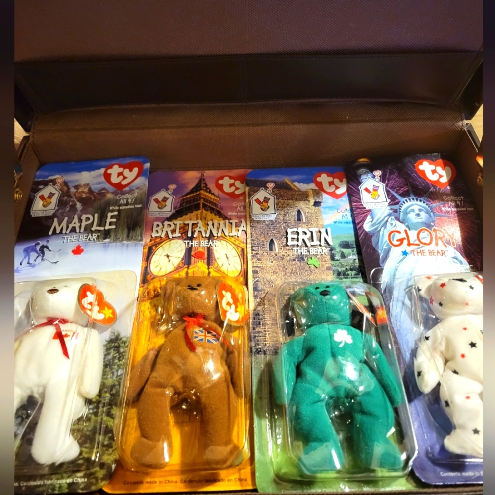 TY beanie babies - international bears. Set of 4 in box factory sealed.